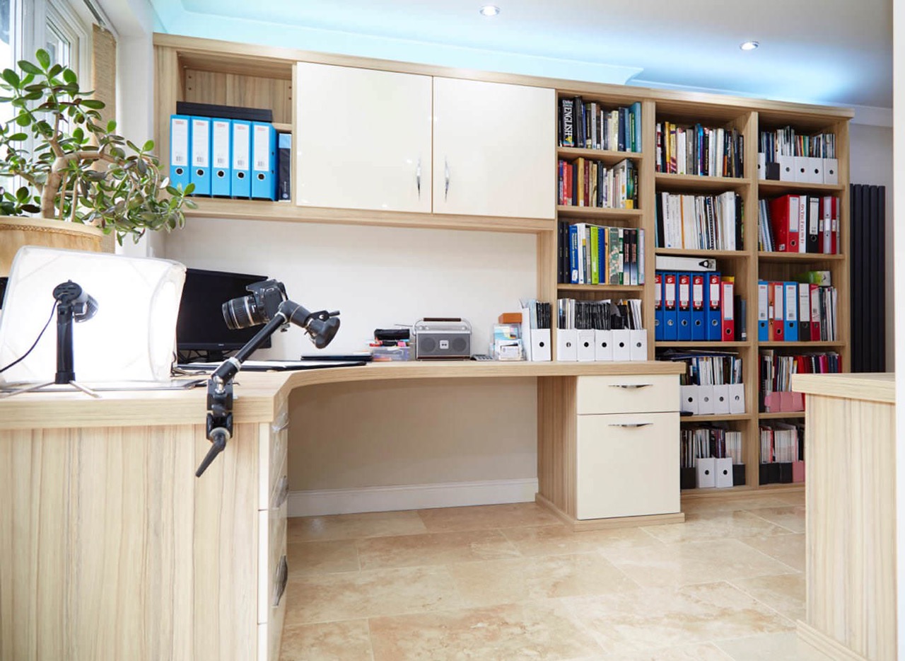 Case study showing curved desk and overhead cabinets in home office Case study showing curved desk and overhead cabinets in home office
