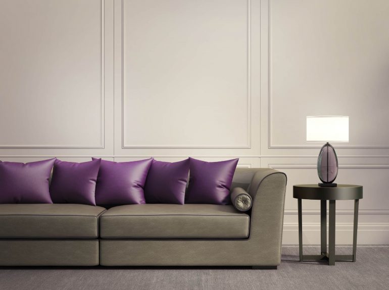 Grey sofa with statement purple scatter cushions