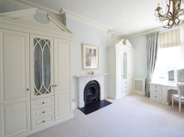 Traditional fitted furniture in master bedroom