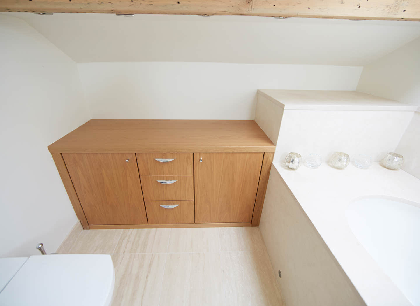 Case study showing fitted bathroom cabinets in loft conversion Case study showing fitted bathroom cabinets in loft conversion