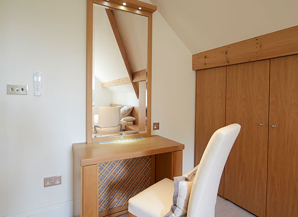 Case study showing vanity table and mirror in loft conversion