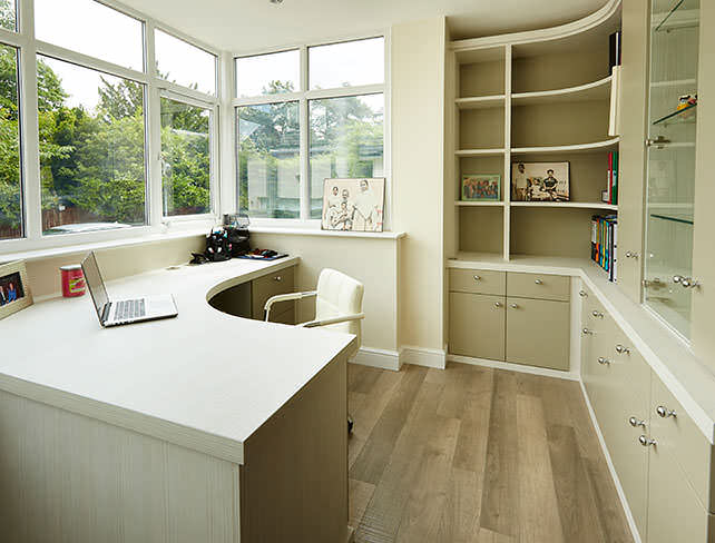 An L-shaped desk fitted into a home office.