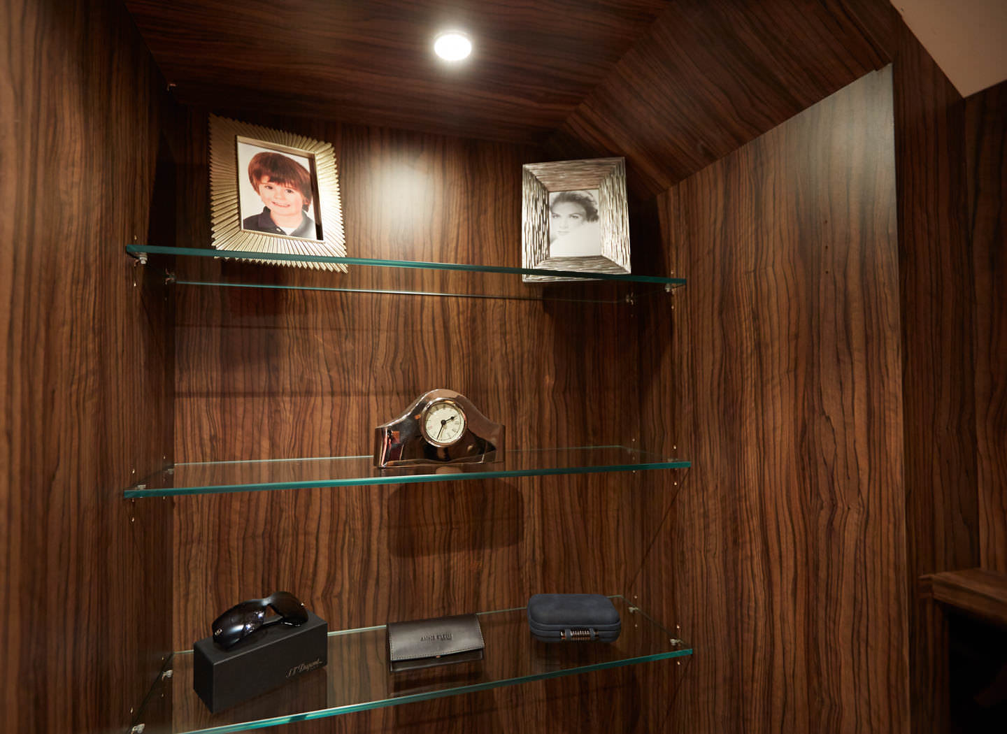 Case study showing glass shelving detail in walk in wardrobe