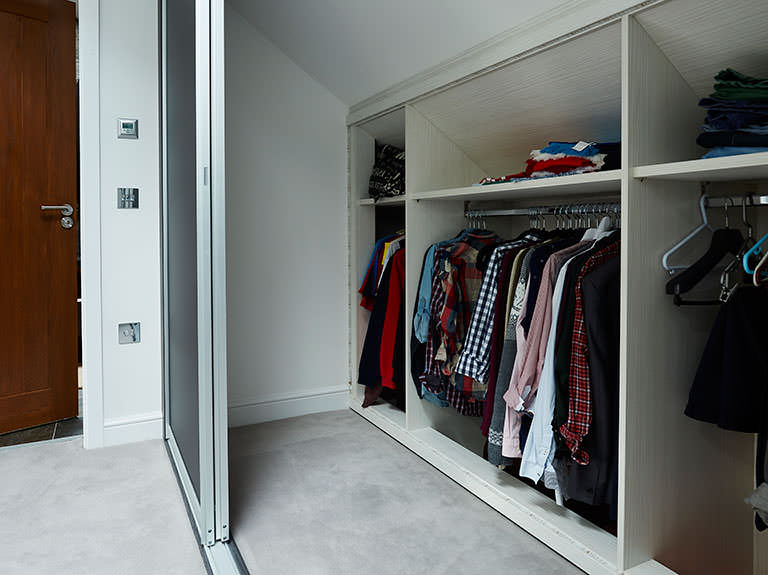 Case study showing storage behind sliding wardrobe doors