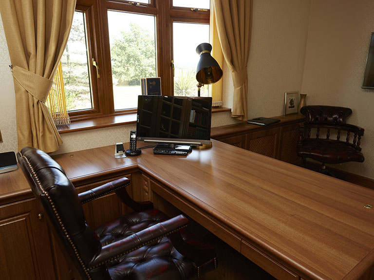 Desk fitted in front of window
