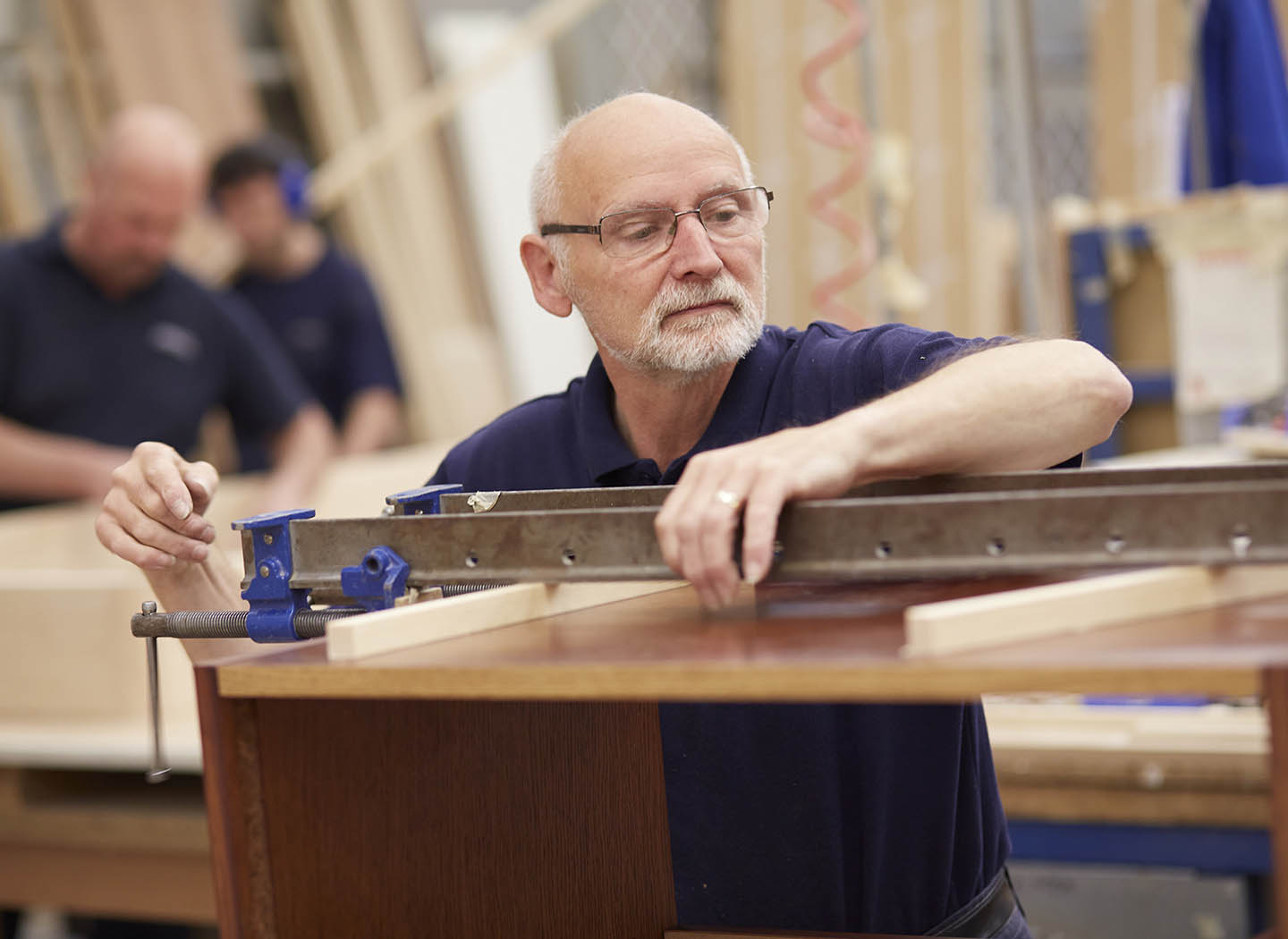 Experienced craftsman working on your furniture