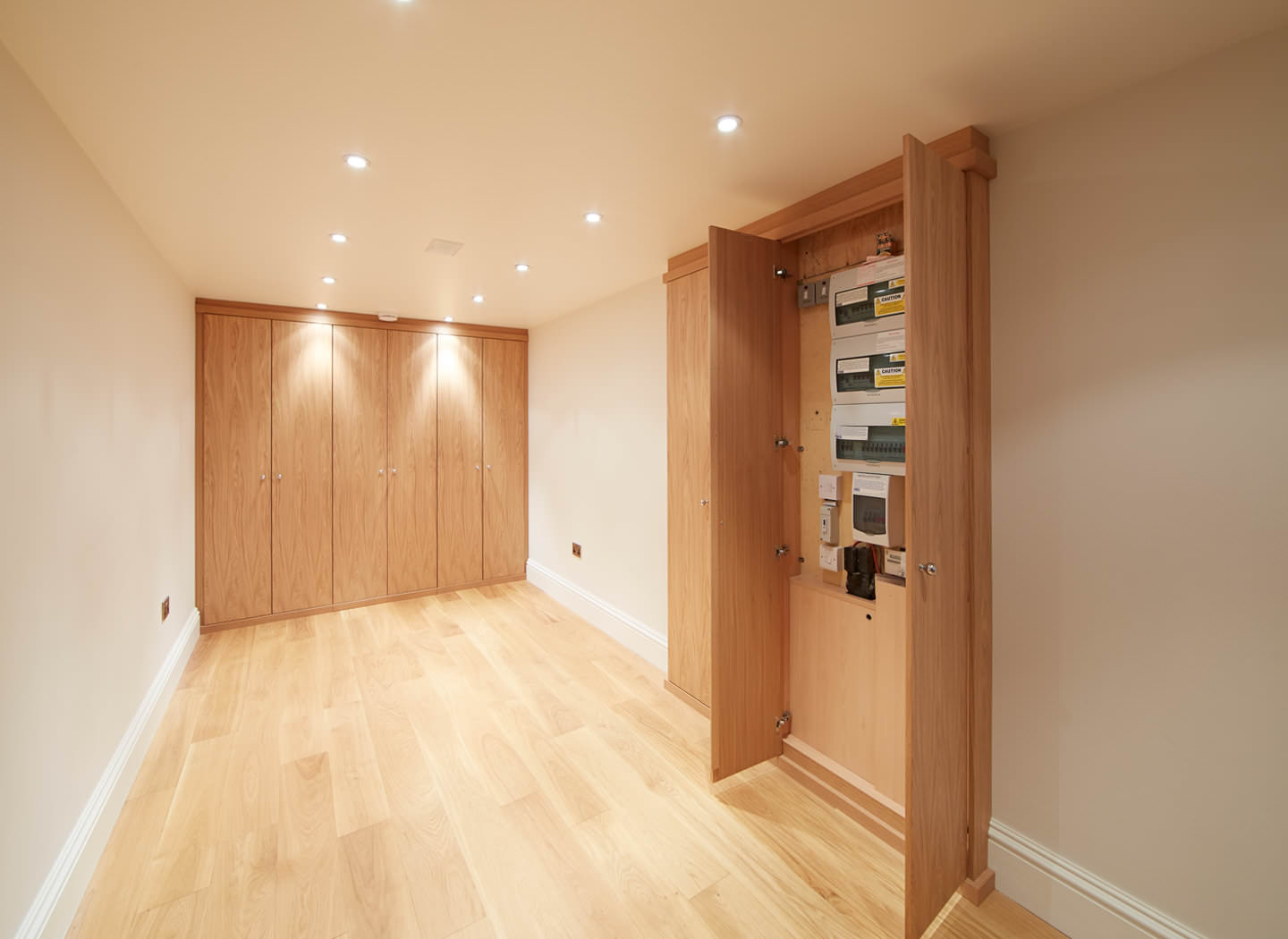 Case study showing meters cupboard in basement conversion