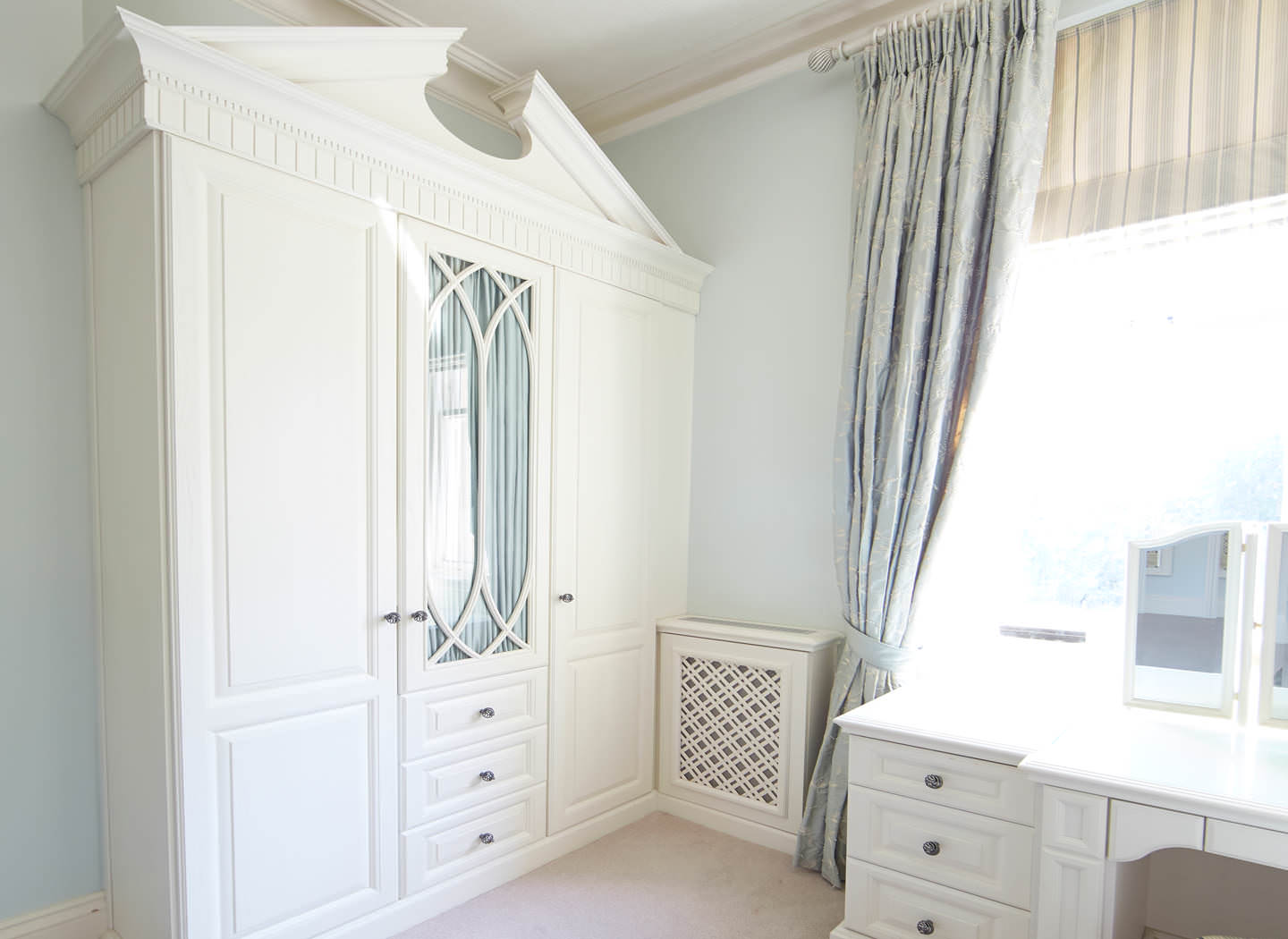 Case study showing wardrobe, desk and radiator cover in bedroom