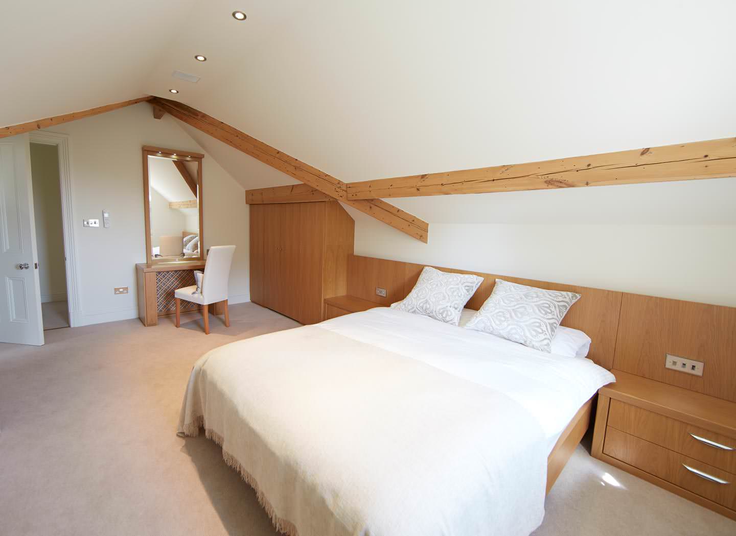 Fitted attic bedroom with sloping roof