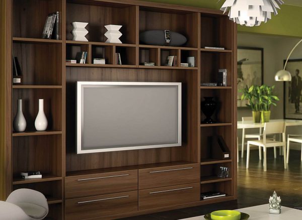 Fitted bookshelves with space for a floating tv