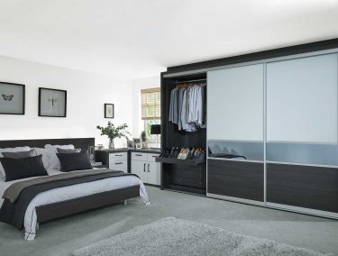 Contemporary bedroom with fitted sliding doors