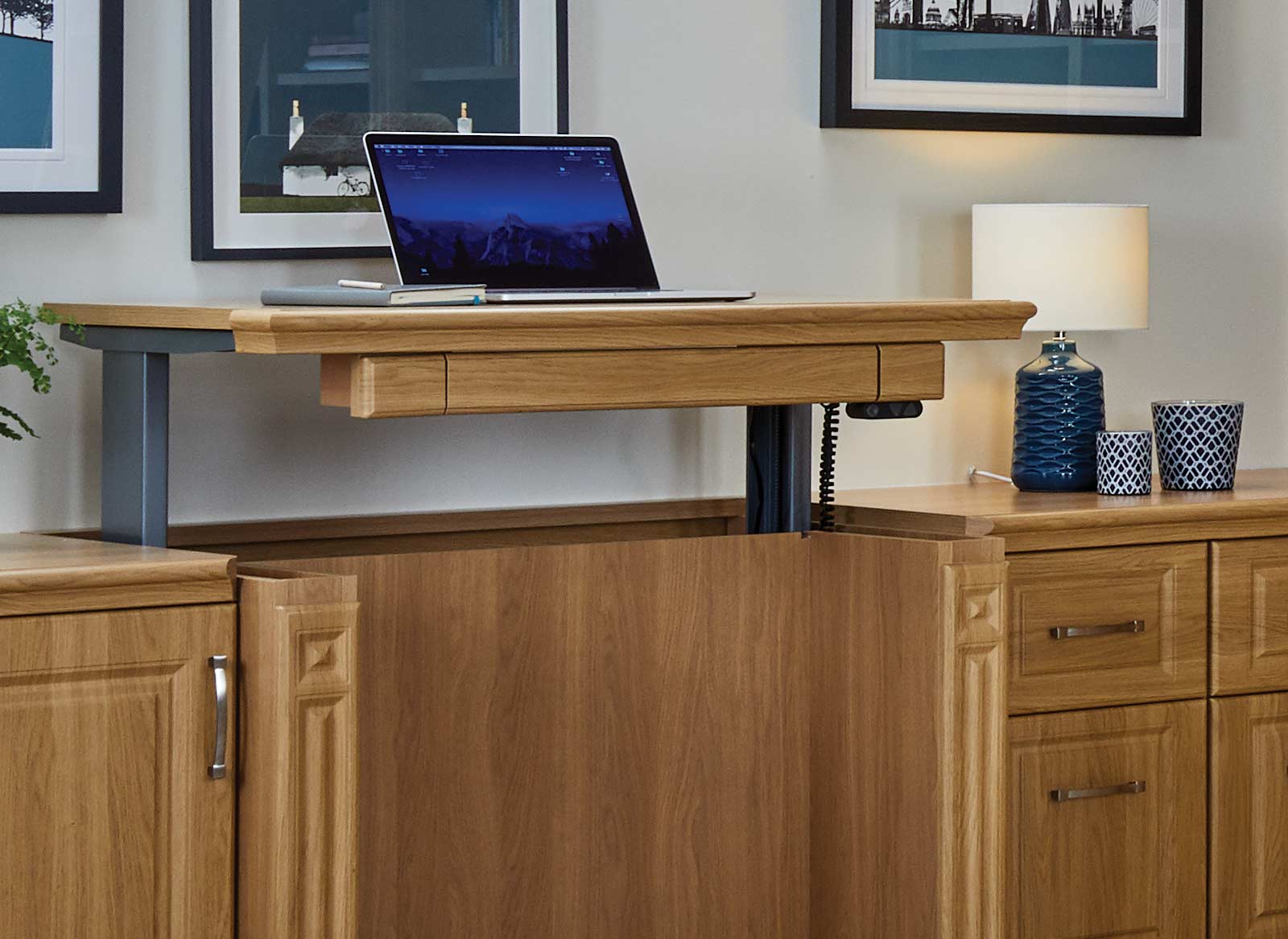 An electric sit-stand desk in a traditional home office