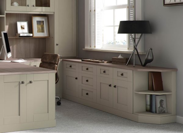 Fitted cabinets and drawers in sage green