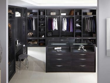 Fitted dressing room in dark wood