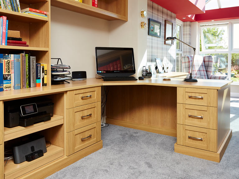 Fitted home office peninsular desk with bespoke bookshelves