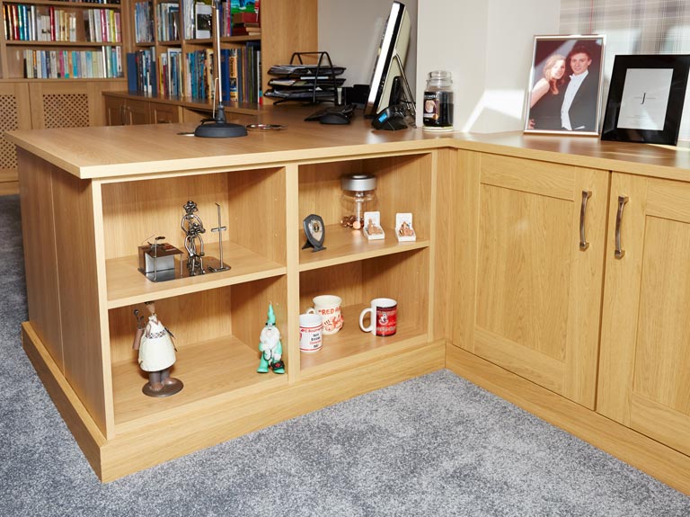 Home office with open ended display cabinets