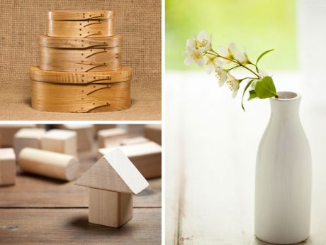 wooden stacked boxes, simple wooden toys and plain ceramic vase with white flowers