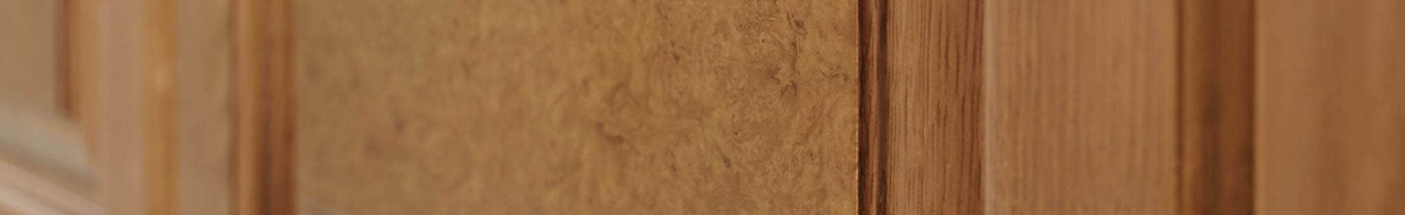 Detail of wardrobe door panel with a burr veneer