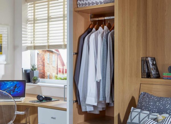 Full length fitted wardrobe unit in English Oak