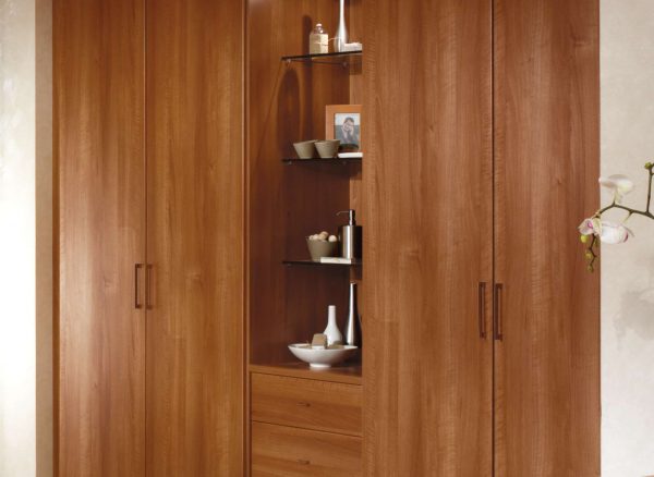 Fitted walnut wardrobes with glass display units