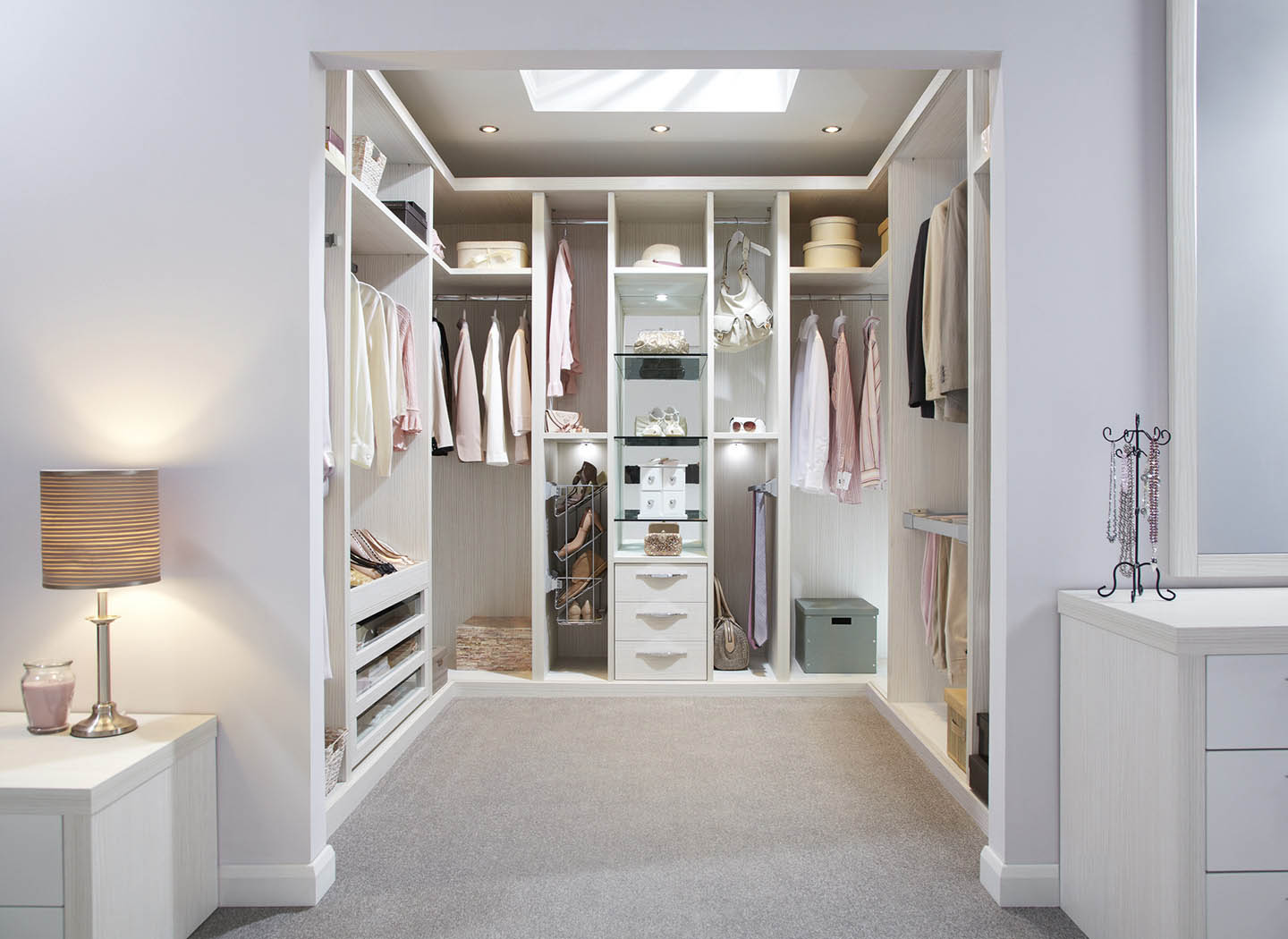 Fitted white walk in wardrobe